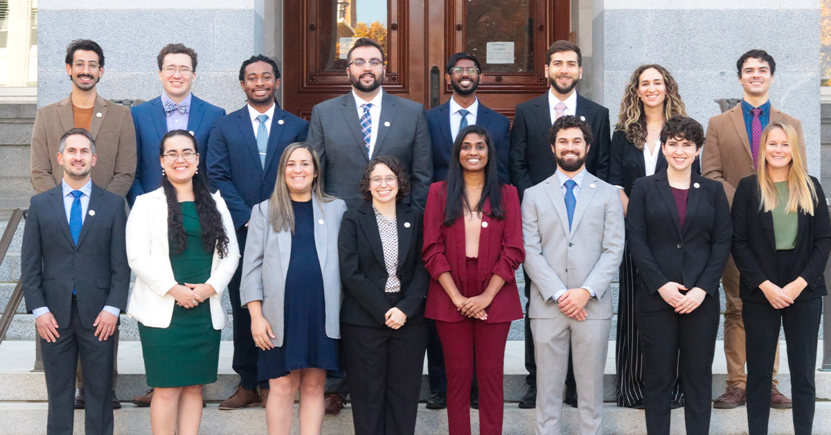 The 2022 CCST S&T Policy Fellows standing in front of the California State Capitol dressed in formal attire.
