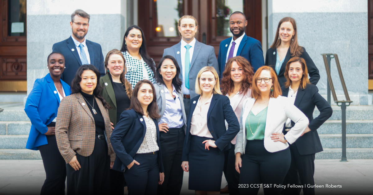 A group photo of the 2023 CCST S&T Policy Fellows standing together in front of the California State Capitol steps dressed in business attire.