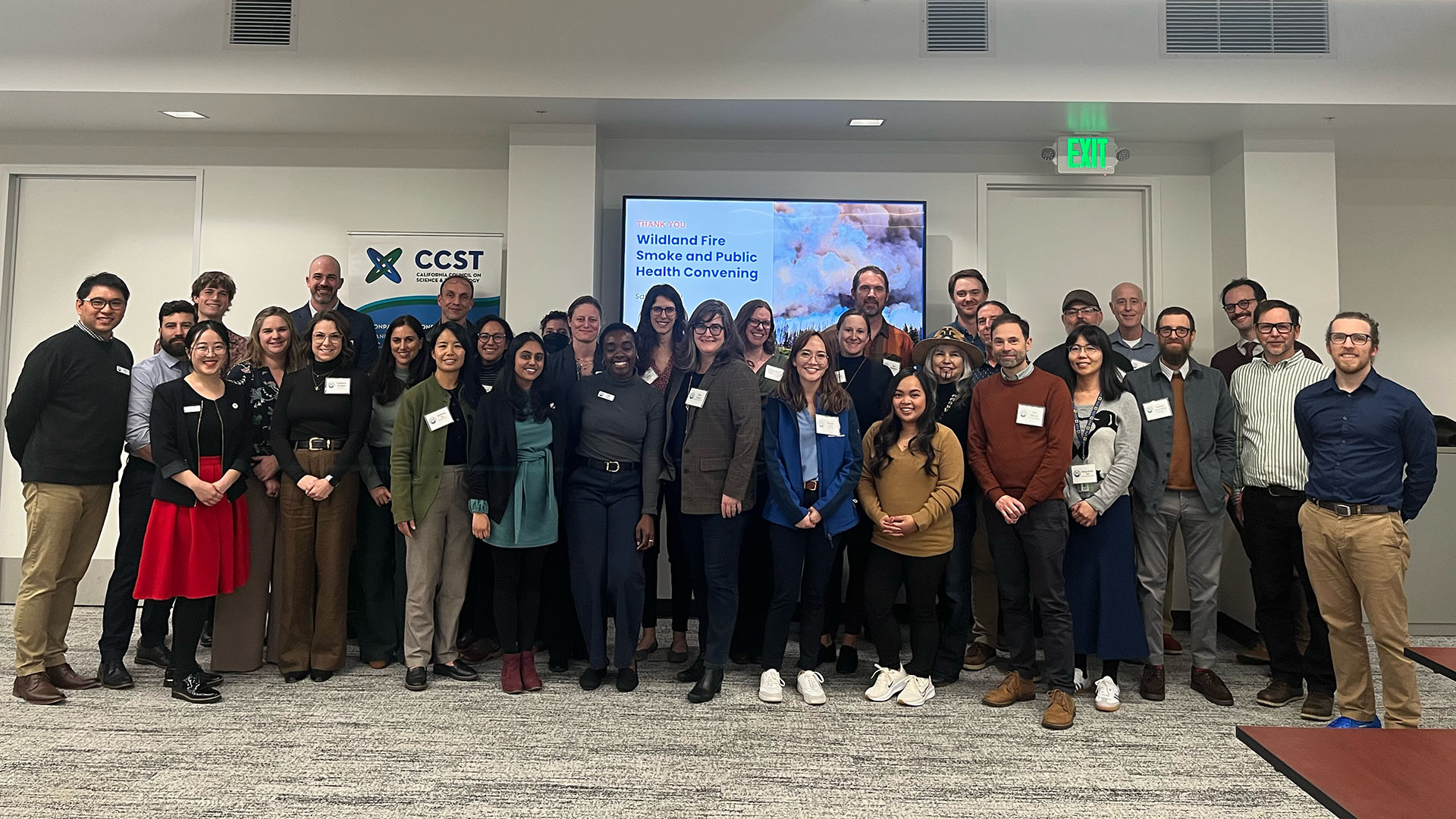 All attendees posing together for a large group photo