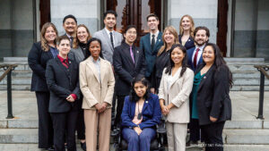 A formal group photo in front of the California State Capitol, with the Fellows in 3 rows.