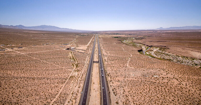 Highway through the desert aerial view matt howard unsplash