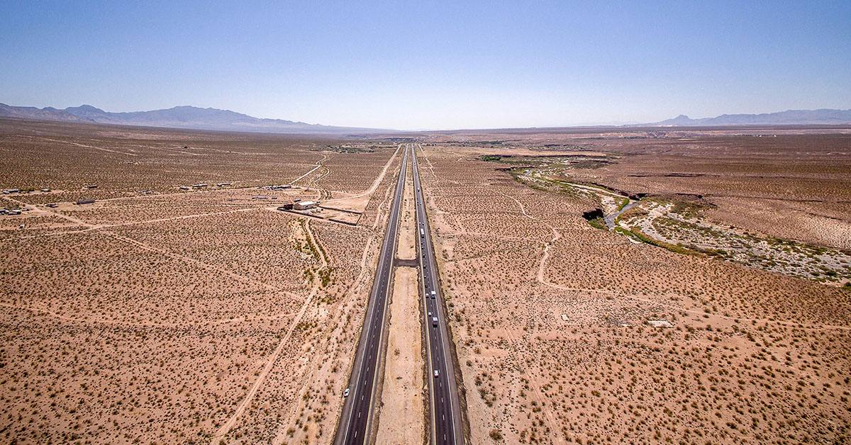 Highway through the desert aerial view matt howard unsplash