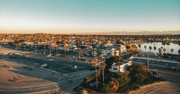 Photo of Southern California with beach, an urban area, and mountains in the background