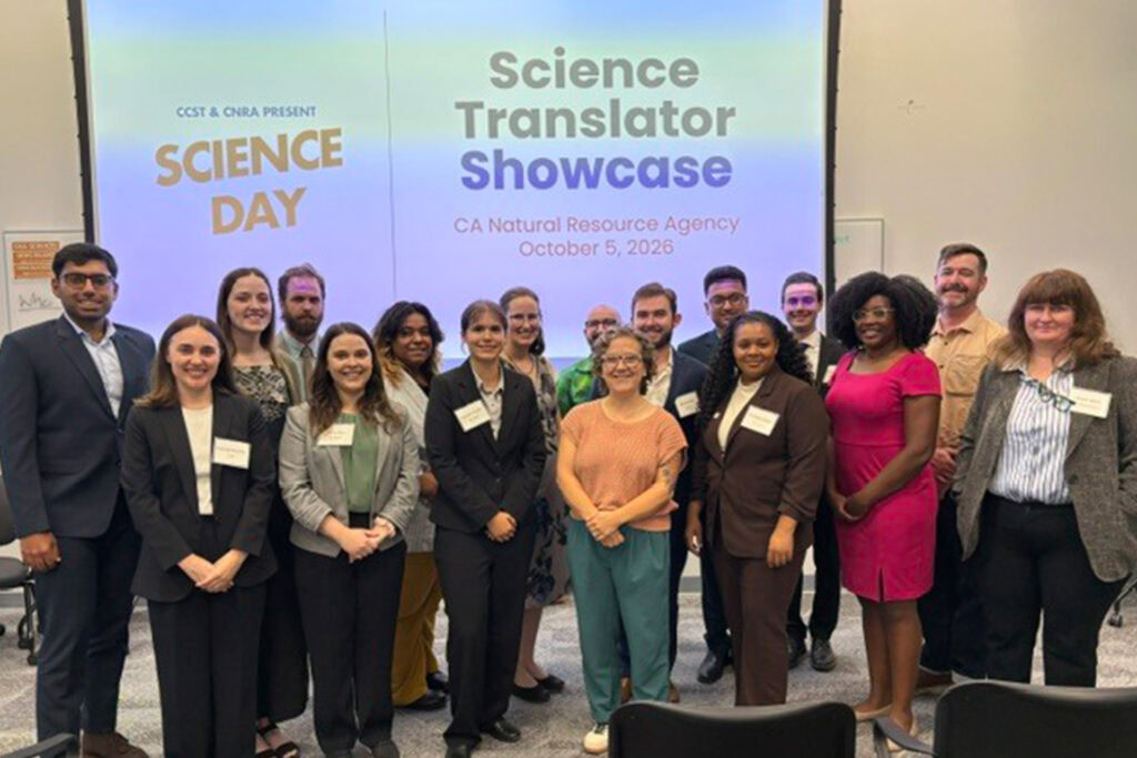Man in suit presenting at Science Day 2026 event.
