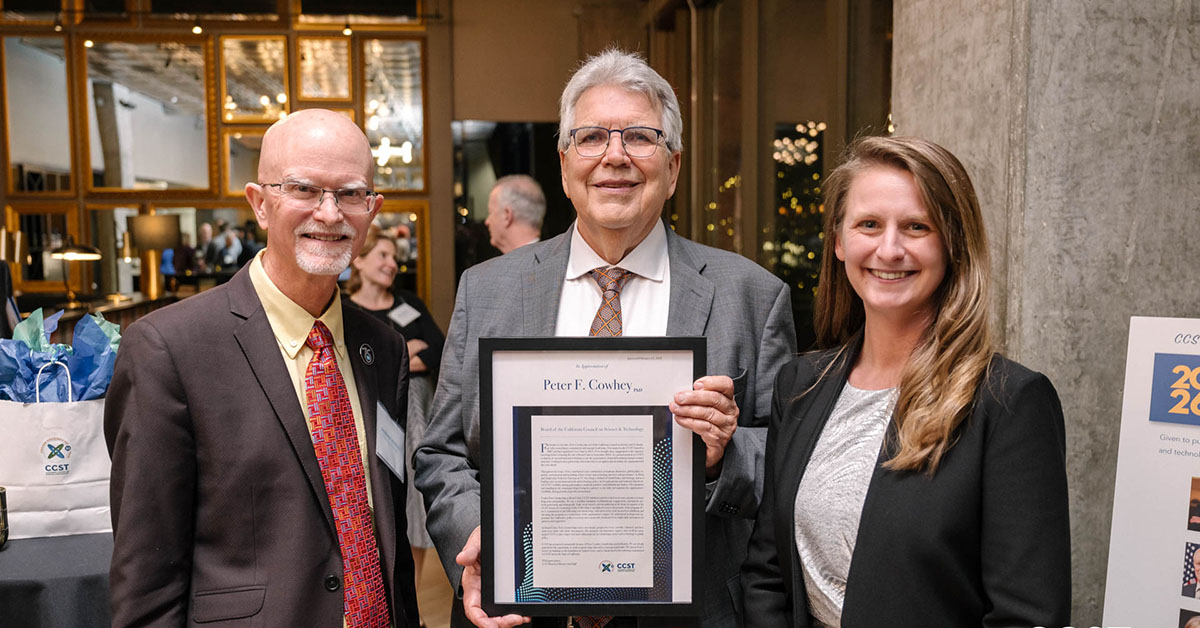 Peter Cowhey receives recognition from Julianne McCall and Andy McIlroy