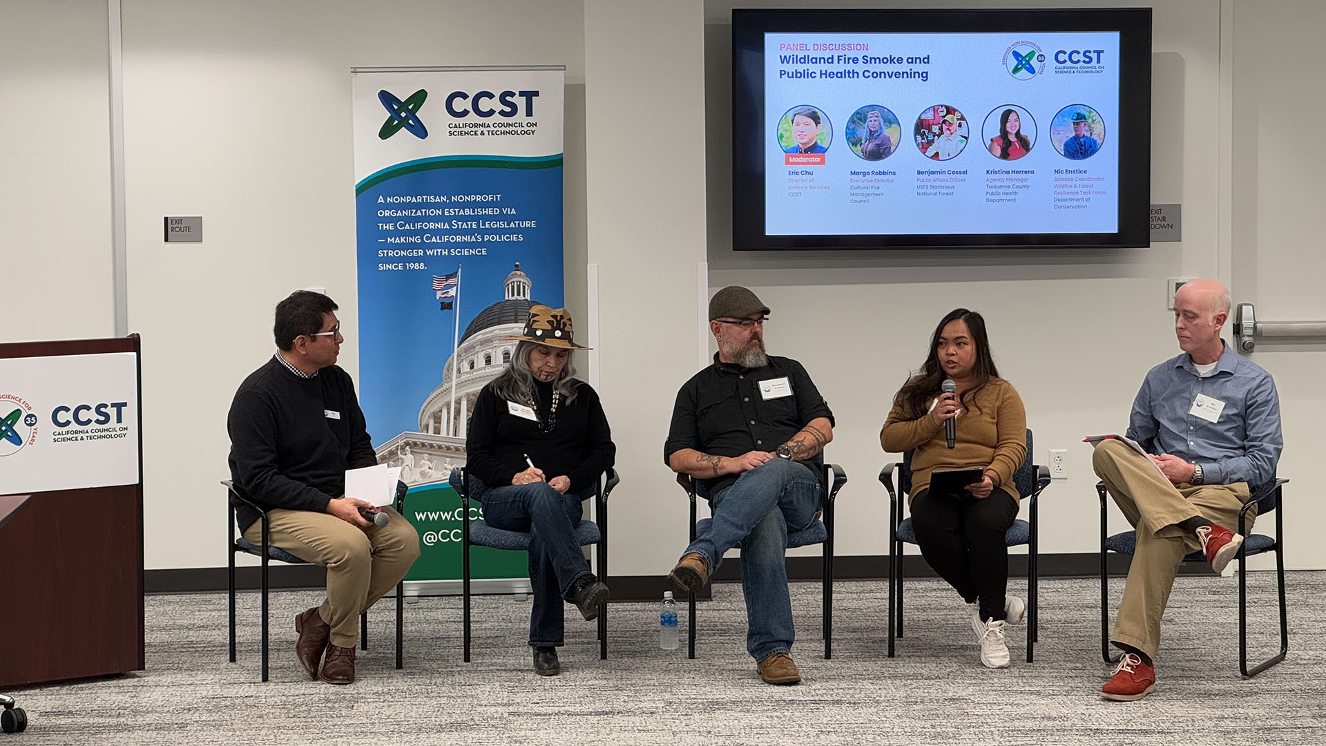 Keynote panelist seated in front of CCST branding at the wildland fire smoke convening