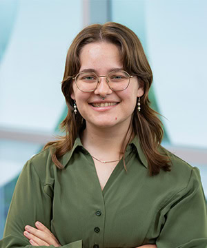 Professional headshot of Gwyn in a green top.