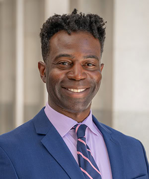 Professional headshot of Justin Norman.