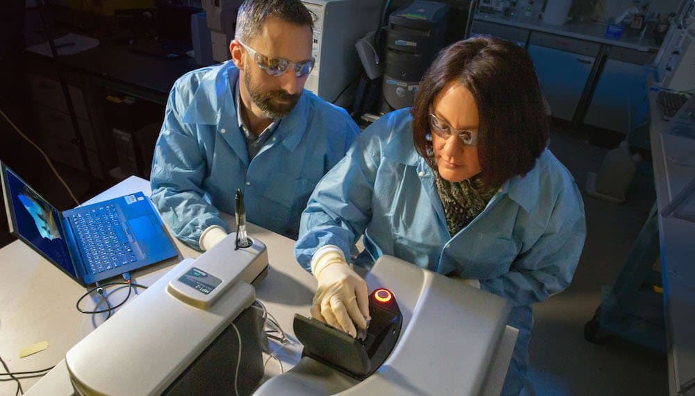 LLNL researchers working on the development of a tularemia vaccine. (Credit: Julie Russell/LLNL)