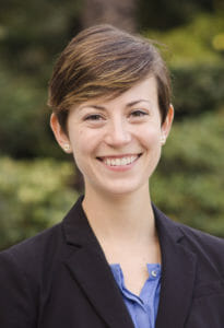 Portrait photo of Laura McWilliams, PhD, a 2017 CCST Science & Technology Policy Fellow. Laura is wearing a lavender-colored blouse under a black suit jacket.