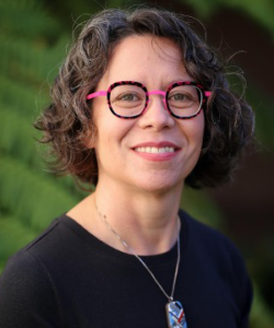 A professional headshot of the Board member.