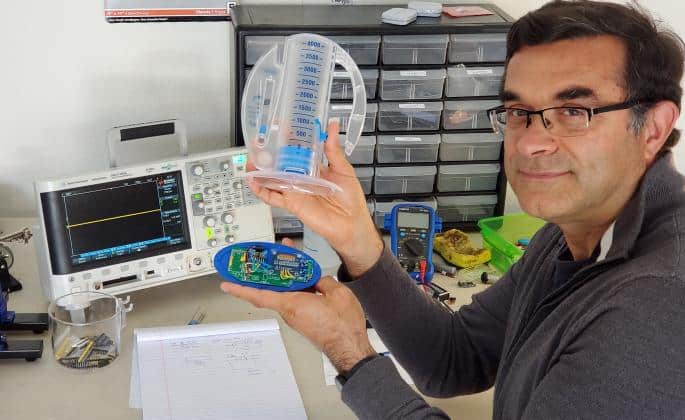 Sonoma State professor Farid Farahmand shows off his InSee spirometer