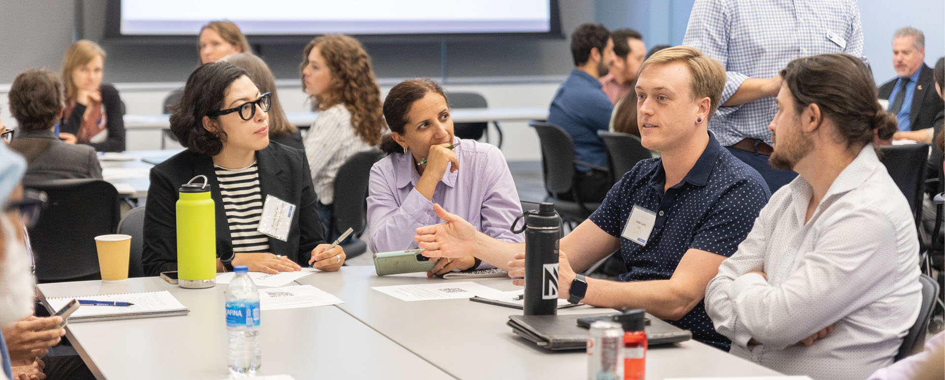 Group sitting at a table during a breakout room discussion at CCST Science Day 2025 at the California Natural Resources Agency